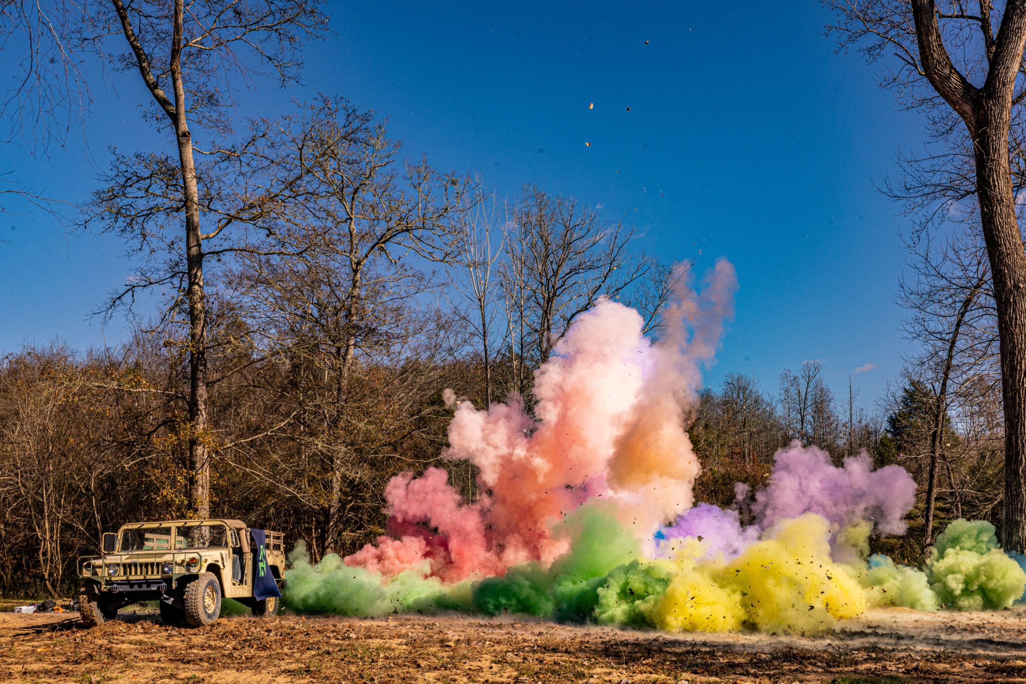 colorful explosion with a jeep to the side of the photo